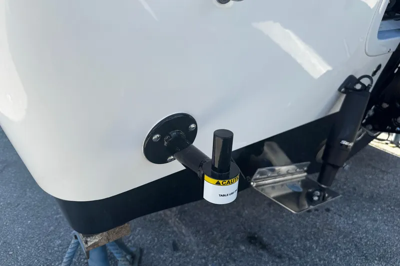 Slide: The Image of 2026 Sea Pro 245FLX Sandbar boat detail with caution label and hardware. - 13