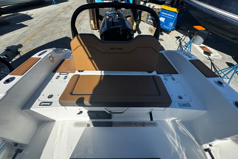 Slide: The Image of 2026 Sea Pro 245FLX Sandbar boat interior with brown seating and modern design. - 16