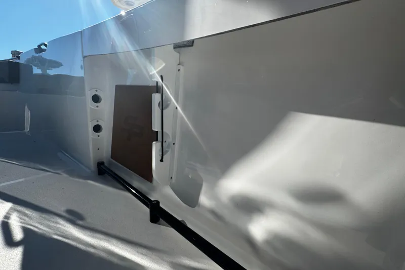 Slide: The Image of 2026 Sea Pro 245FLX Sandbar boat interior with sleek design and sunlight reflections. - 25