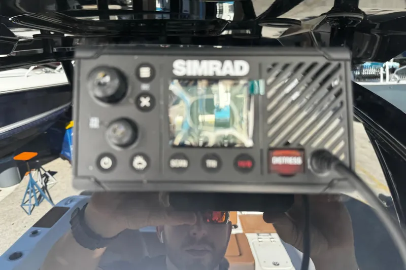 Slide: The Image of Simrad marine device on 2026 Sea Pro 245FLX Sandbar boat, close-up view. - 36