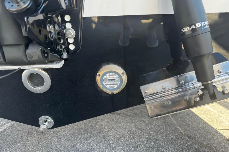 Slide: The Image of Close-up of 2026 Sea Pro 245FLX Sandbar boat's rear components and SeaStar hydraulic system. - 7