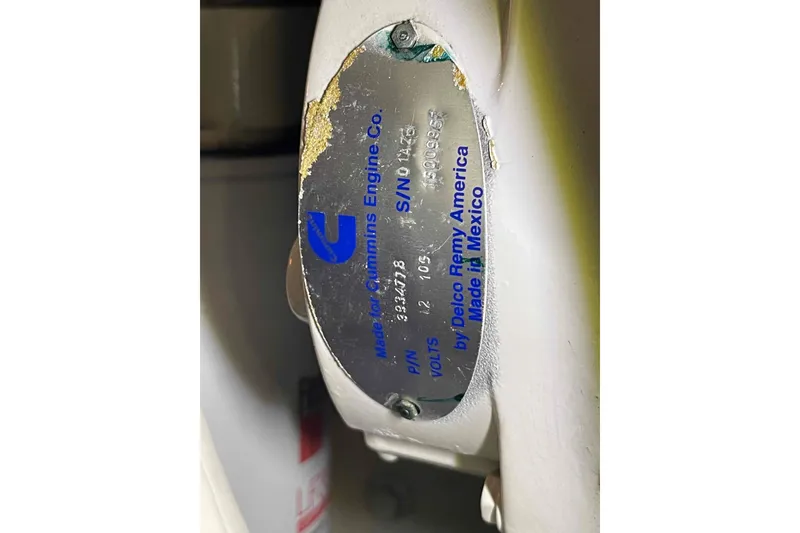 Slide: The Image of Engine plate on a 2002 President Trawler, featuring Cummins branding and specifications. - 103