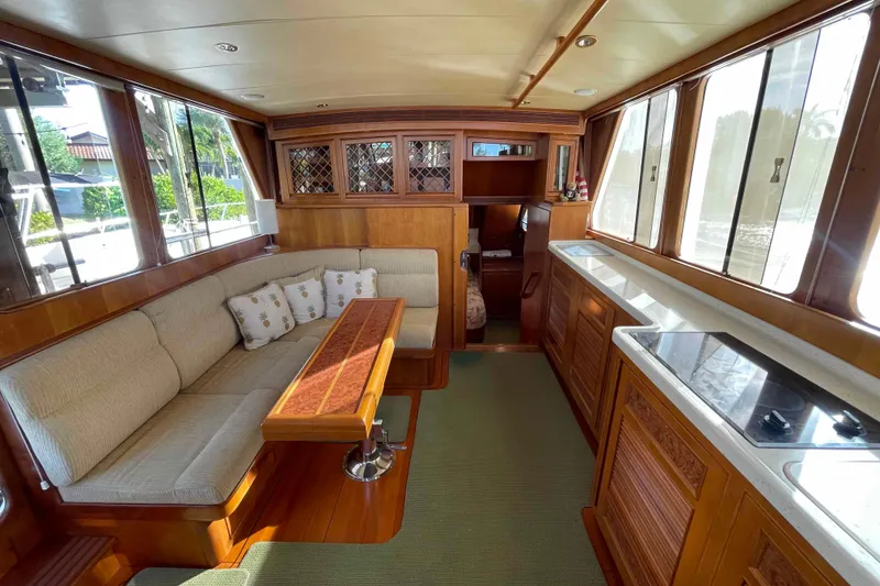 Slide: The Image of Luxurious interior of a 2002 President Trawler yacht with elegant wood finishes and cozy seating. - 31
