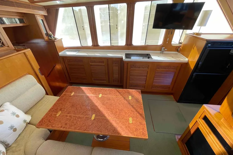 Slide: The Image of Luxurious 2002 President Trawler interior with elegant wood finishes and modern amenities. - 4