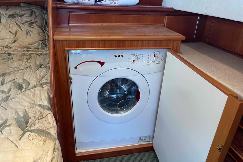 Slide: The Image of Compact washing machine in 2002 President Trawler's wooden interior cabin. - 64