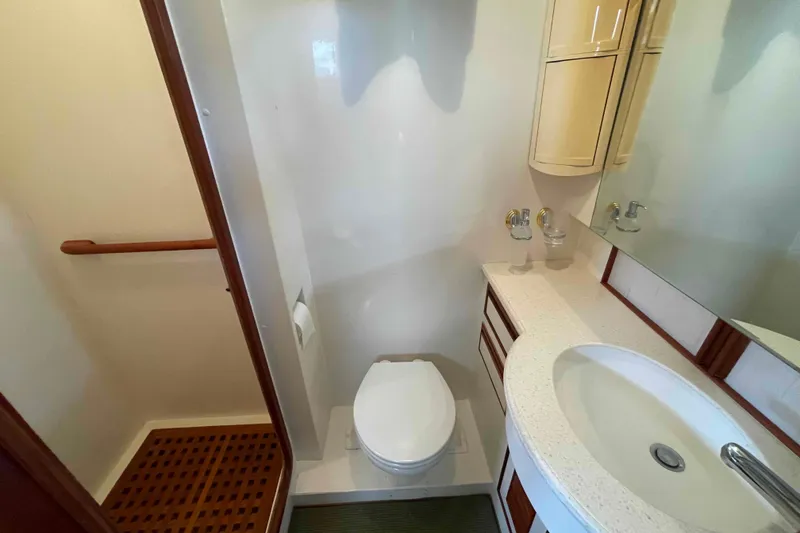 Slide: The Image of Bathroom interior of 2002 President Trawler yacht with sink and toilet. - 68