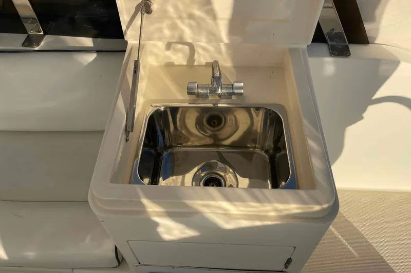 Slide: The Image of Stainless steel sink on 2002 President Trawler yacht, reflecting sunlight. - 78