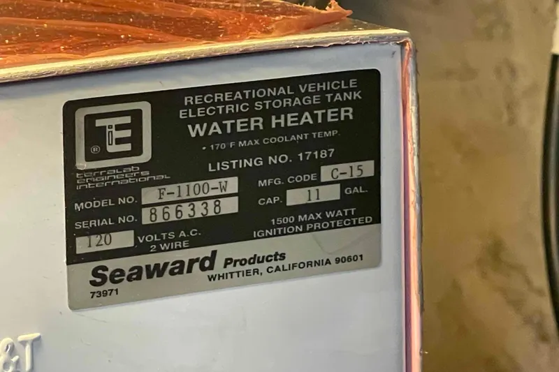 Slide: The Image of Label on Seaward water heater for recreational vehicles, model F-1100-W, 11-gallon capacity. - 87