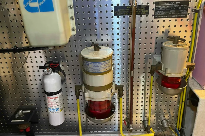 Slide: The Image of Engine room of 2002 President Trawler with fuel filters and fire extinguisher. - 88