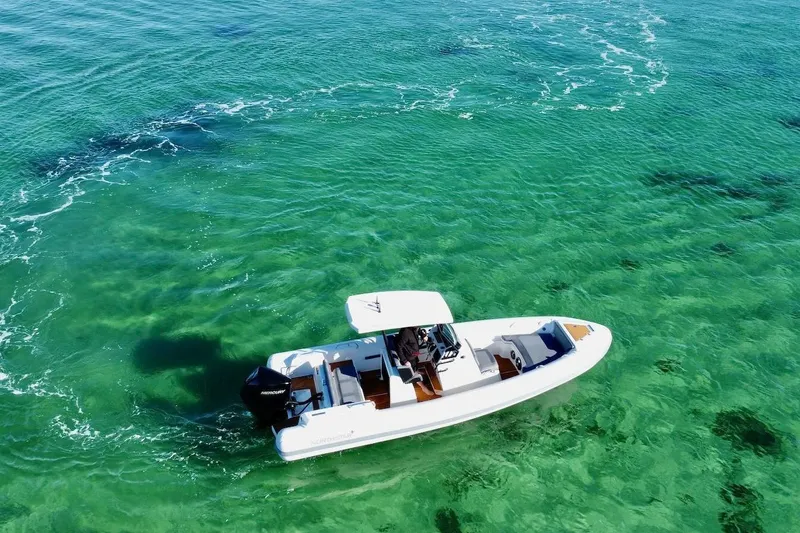 Slide: The Image of Aerial view of 2026 Northstar Orion 7 boat on clear turquoise water. - 2