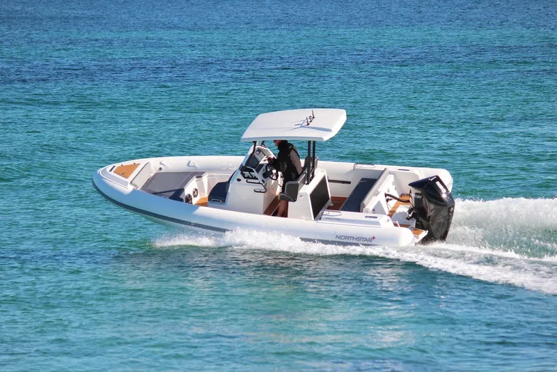 Slide: The Image of 2026 Northstar Orion 7 boat cruising on clear blue water. - 3