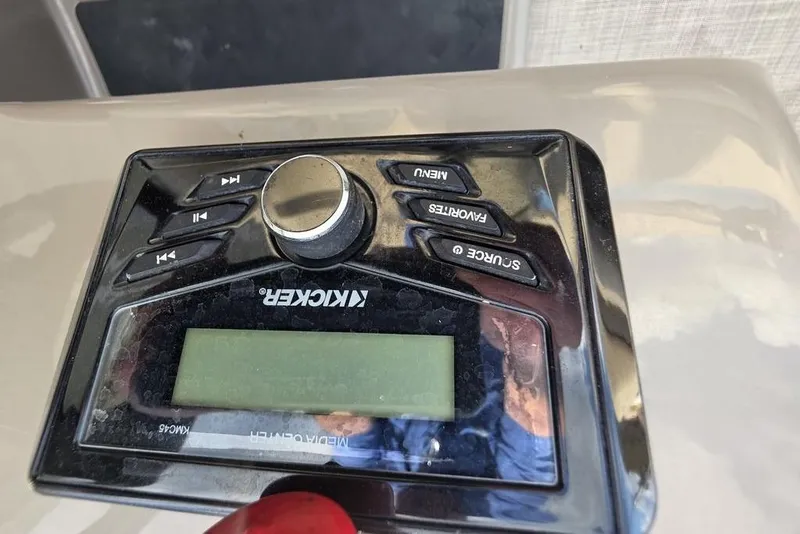 Slide: The Image of Kicker media control panel on 2023 Sun Tracker Party Barge 18 DLX. - 16