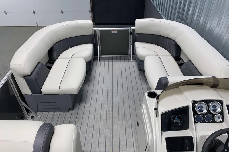 Slide: The Image of 2026 Sylvan Mirage 820 Cruise interior with plush seating and modern dashboard. - 4