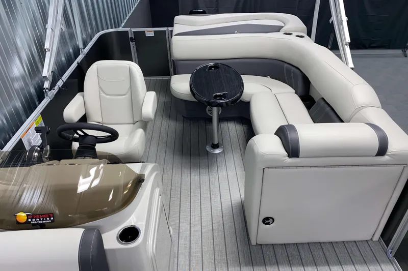 Slide: The Image of 2026 Sylvan Mirage 820 Cruise interior with plush seating and sleek design. - 5