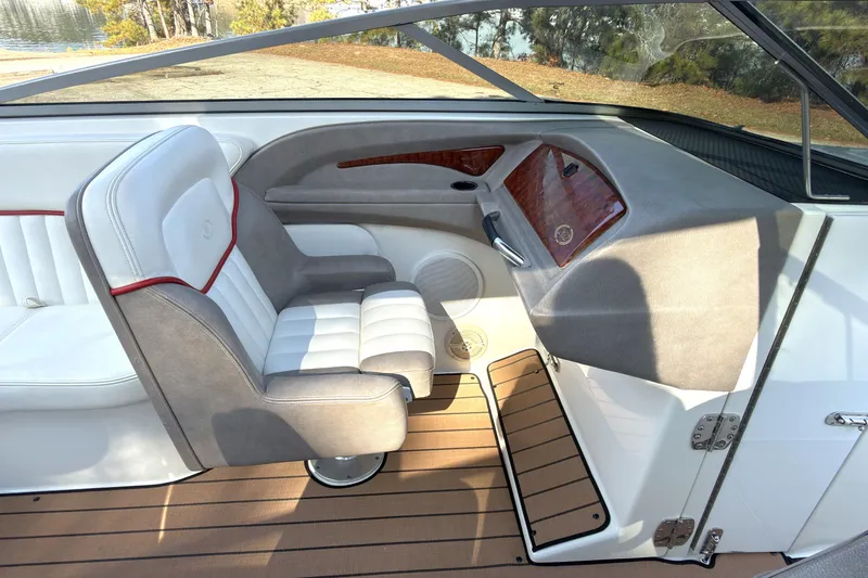 Slide: The Image of Interior of a 2004 Cobalt 262 boat with white and gray seating. - 10