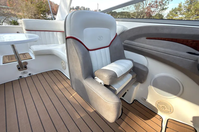 Slide: The Image of Interior of a 2004 Cobalt 262 boat with luxurious seating and wood flooring. - 11