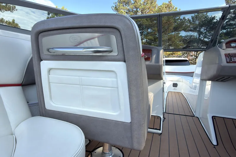 Slide: The Image of Interior of a 2004 Cobalt 262 boat, featuring sleek seating and modern design elements. - 12