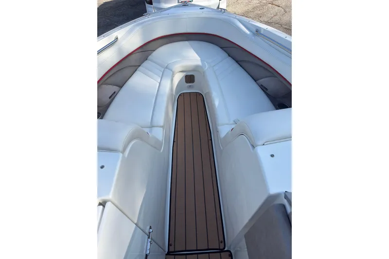 Slide: The Image of Interior of 2004 Cobalt 262 boat with white seating and wood-style flooring. - 13