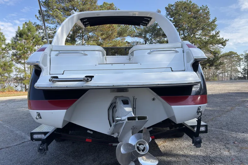 Slide: The Image of Rear view of a 2004 Cobalt 262 boat with propeller, parked outdoors. - 21
