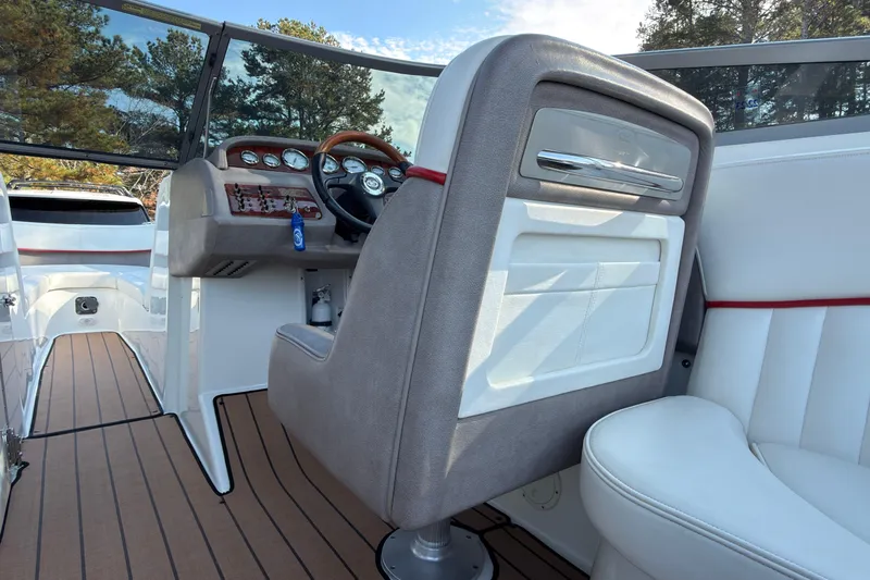 Slide: The Image of Interior of a 2004 Cobalt 262 boat with steering wheel and dashboard. - 7