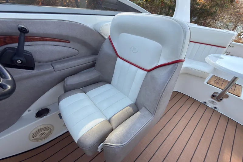 Slide: The Image of 2004 Cobalt 262 boat interior with plush seating and elegant design. - 9