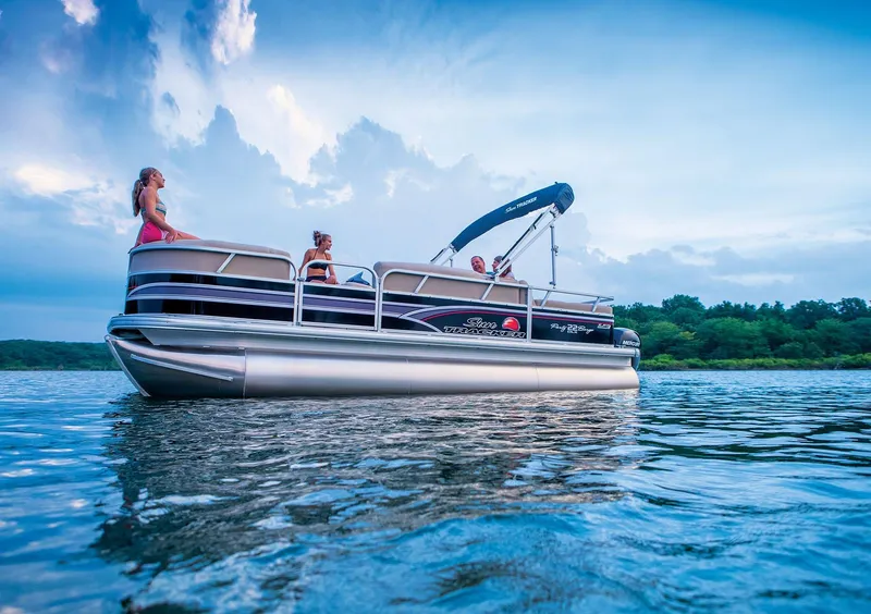 Slide: The Image of 2015 Sun Tracker Party Barge 22 XP3 interior with beige seating and steering console. - 10
