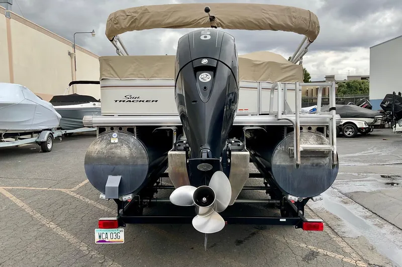 Slide: The Image of 2015 Sun Tracker Party Barge 22 XP3 pontoon boat with Mercury outboard motor on trailer. - 4