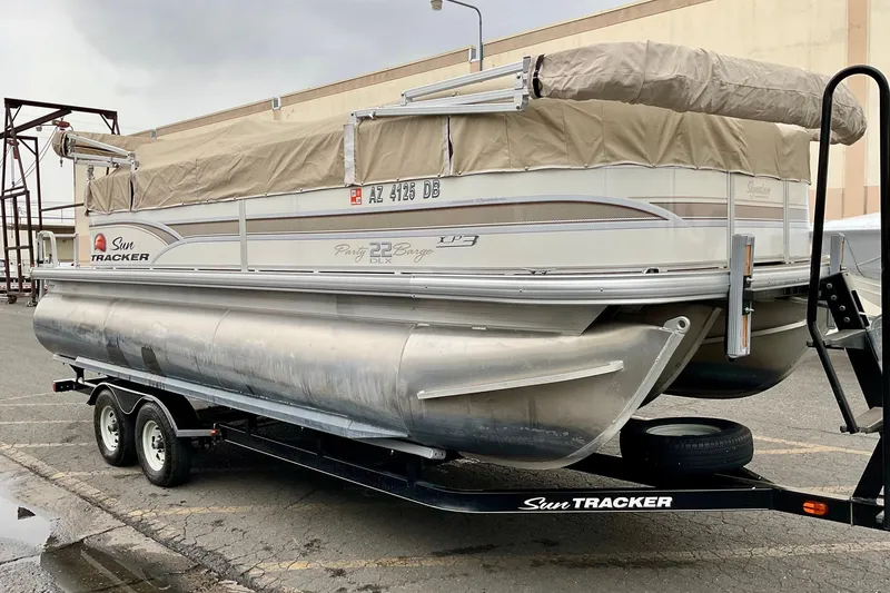 Slide: The Image of 2015 Sun Tracker Party Barge 22 XP3 pontoon boat with beige seating and canopy. - 7
