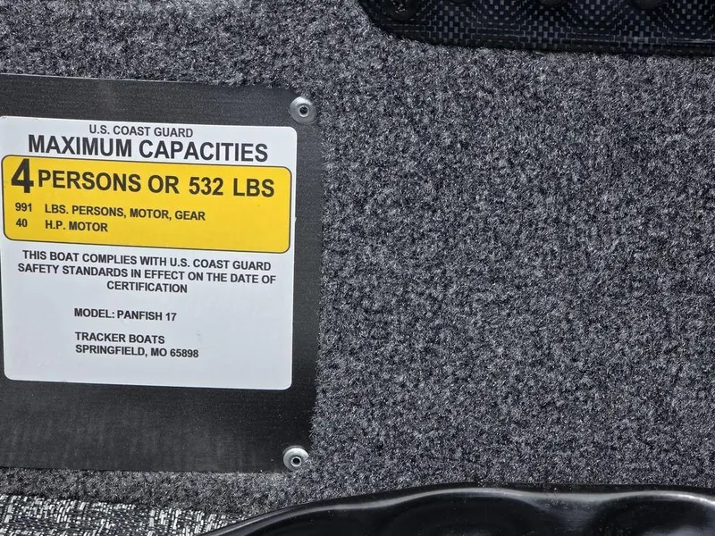 Slide: The Image of 2025 Tracker Panfish™ 17 capacity label: 4 persons or 532 lbs, U.S. Coast Guard compliant. - 15