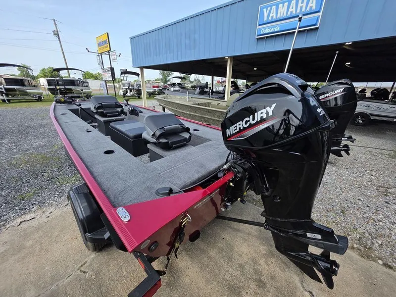 Slide: The Image of 2025 Tracker Panfish™ 17 boat with Mercury engine, parked outside Yamaha dealership. - 16