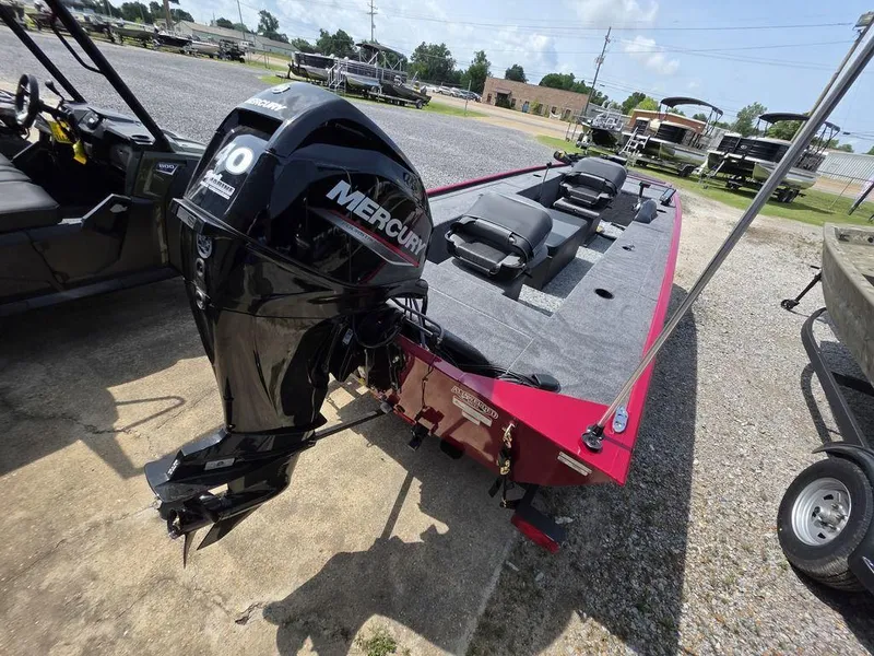 Slide: The Image of 2025 Tracker Panfish™ 17 boat with Mercury motor, parked outdoors on a sunny day. - 19