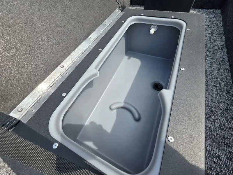 Slide: The Image of Livewell compartment in 2025 Tracker Panfish™ 17 boat, featuring durable construction and efficient drainage. - 3