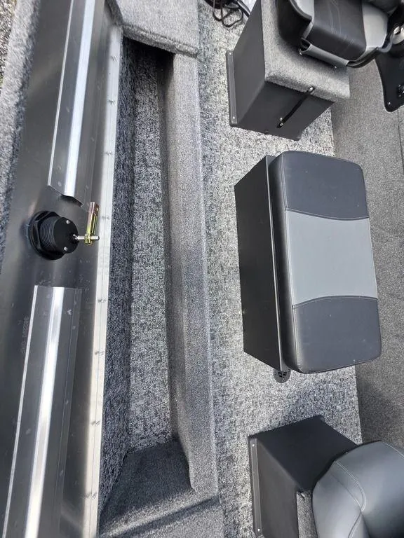 Slide: The Image of 2025 Tracker Panfish™ 17 boat interior with gray seating and carpeted flooring. - 9