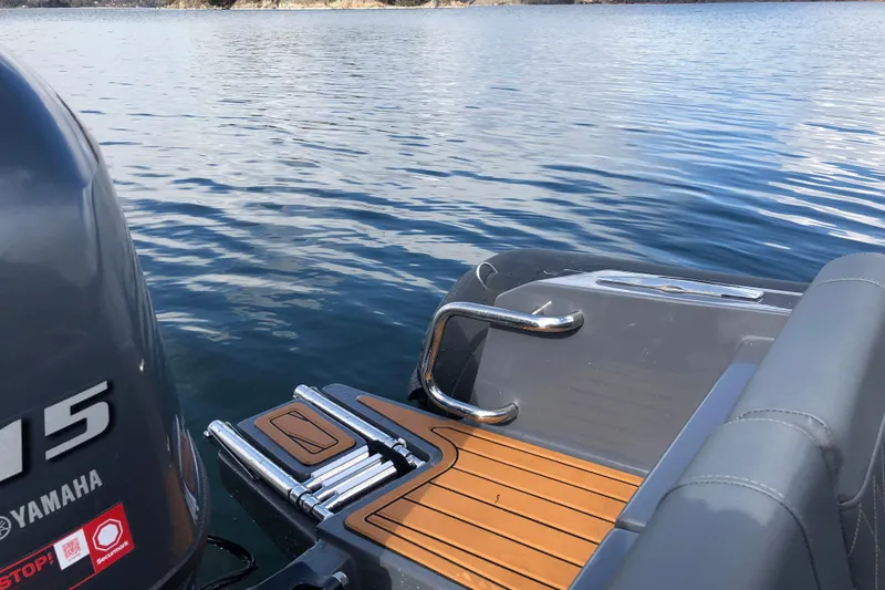 Slide: The Image of Northstar Orion 6 boat, 2026 model, with Yamaha engine on calm water. - 6