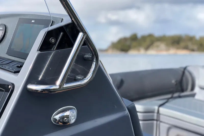 Slide: The Image of Close-up of 2026 Northstar Orion 6 boat dashboard with steering handle and display. - 7