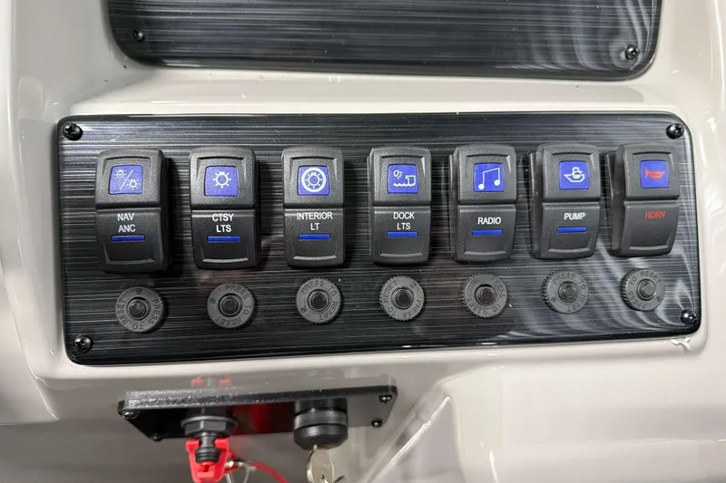 Slide: The Image of Control panel of 2026 Sylvan Mirage 820 LZ with labeled switches for various functions. - 11