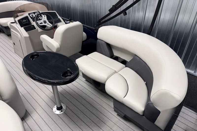 Slide: The Image of Interior of 2026 Sylvan Mirage 820 LZ pontoon boat with plush seating and sleek table. - 13