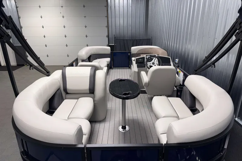 Slide: The Image of 2026 Sylvan Mirage 820 LZ pontoon boat interior with plush seating and modern helm. - 15