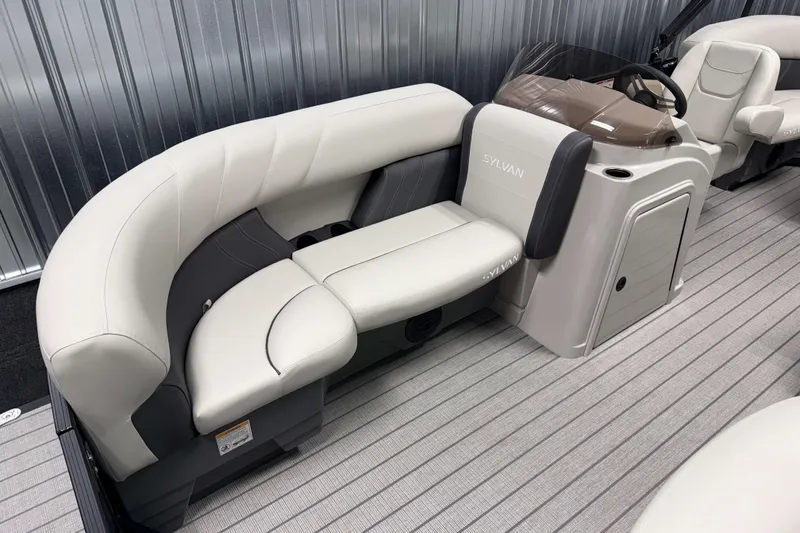 Slide: The Image of 2026 Sylvan Mirage 820 LZ boat interior with plush seating and modern design. - 2