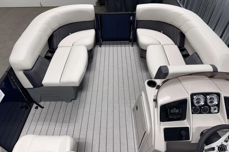 Slide: The Image of 2026 Sylvan Mirage 820 LZ pontoon boat interior with plush seating and modern dashboard. - 4