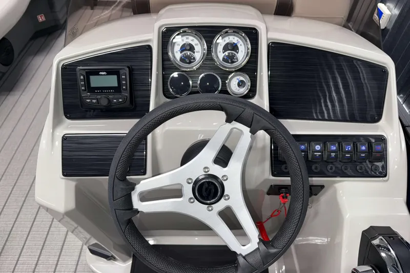 Slide: The Image of 2026 Sylvan Mirage 820 LZ dashboard with steering wheel and control panel. - 8