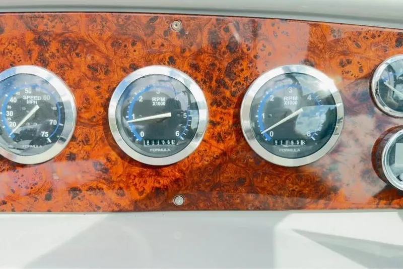 Slide: The Image of Dashboard of 2005 Formula 330 Sun Sport with speedometer and RPM gauges. - 12