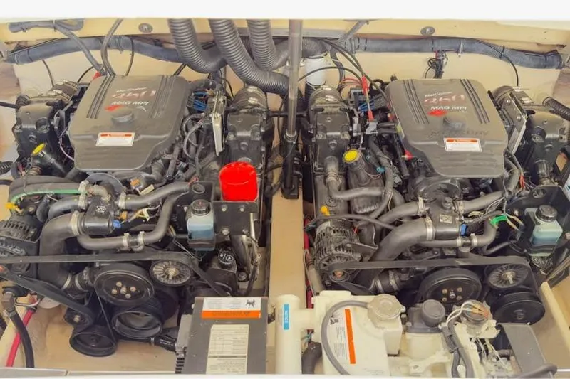 Slide: The Image of Twin engines of a 2005 Formula 330 Sun Sport boat, showcasing detailed components. - 13