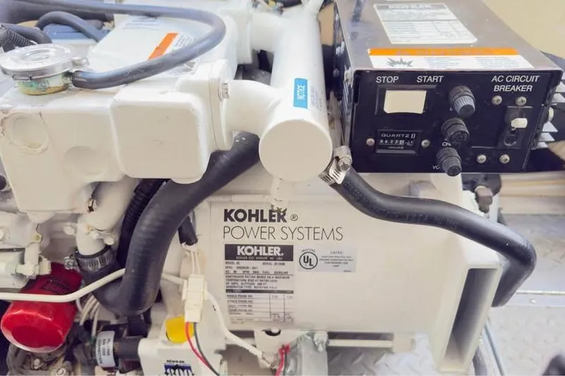 Slide: The Image of Kohler power system in 2005 Formula 330 Sun Sport boat engine compartment. - 14