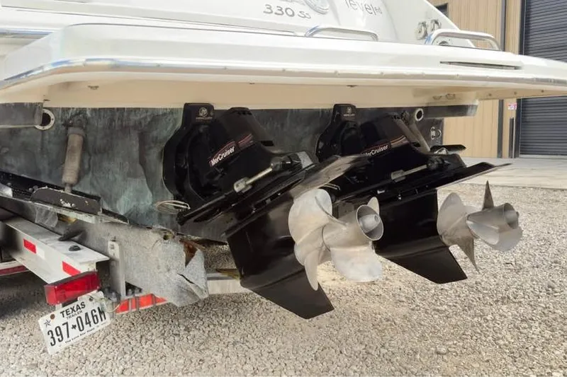 Slide: The Image of 2005 Formula 330 Sun Sport boat with dual propellers on a trailer. - 3