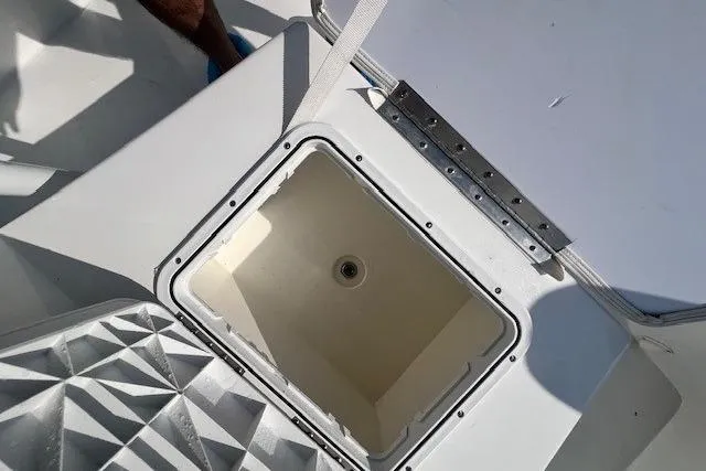 Slide: The Image of Open storage compartment on 2024 Savannah SS21 boat deck. - 16
