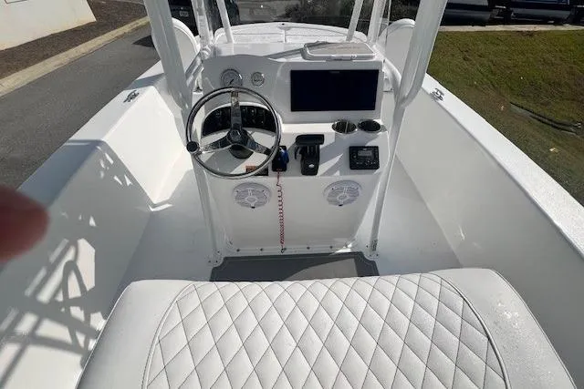 Slide: The Image of 2024 Savannah SS21 boat interior with steering wheel and dashboard controls. - 17