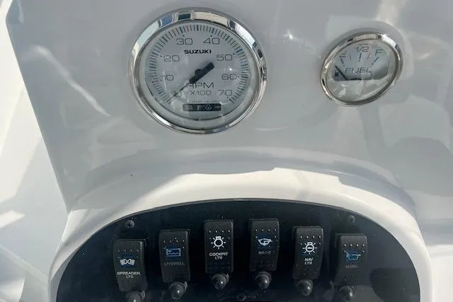 Slide: The Image of Dashboard of 2024 Savannah SS21 boat with Suzuki RPM and fuel gauges. - 8