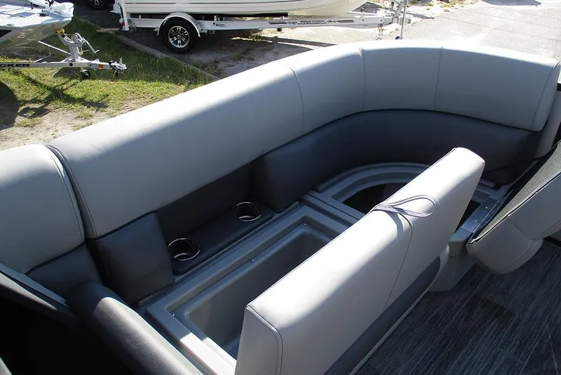 Slide: The Image of 2026 Bentley Pontoons Legacy 220 Swingback interior seating with cup holders and storage. - 12
