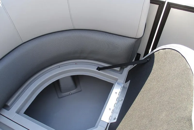 Slide: The Image of 2026 Bentley Pontoons Legacy 220 Swingback storage compartment with open seat cushion. - 13